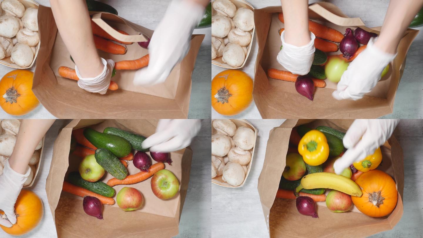 女人用手把水果和蔬菜放进硬纸袋里