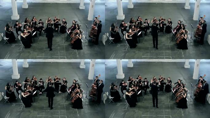 管弦乐队在交响乐厅演奏小提琴