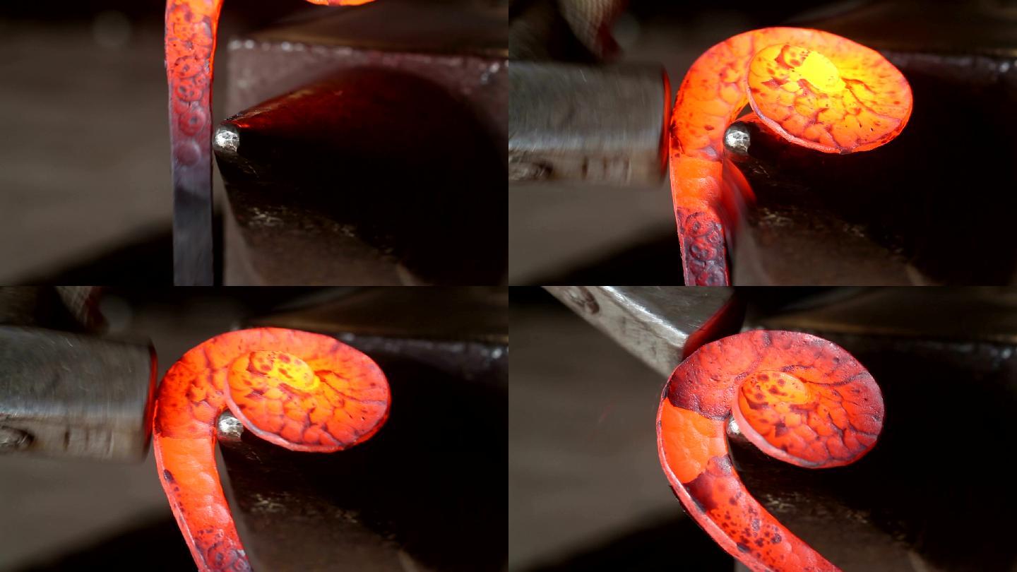铁匠师傅在铁匠铺的铁砧上锻造炽热的红铁