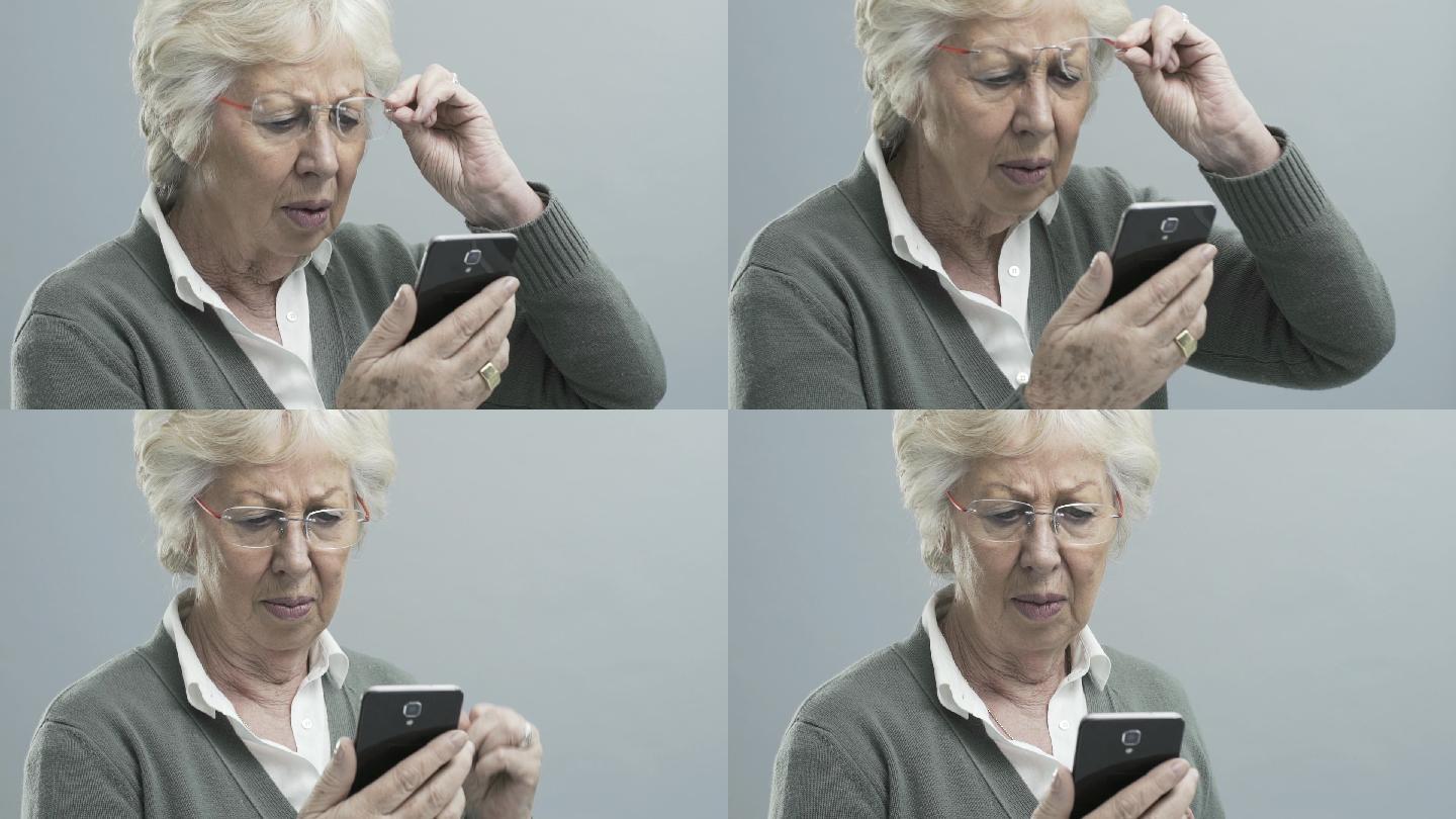 有视力问题的老年女性使用智能手机
