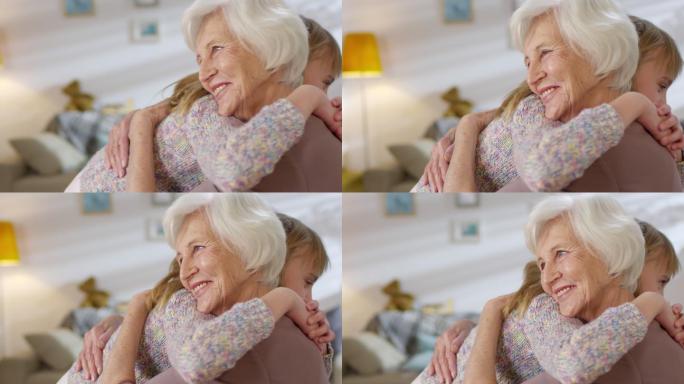 拥抱祖母的小女孩抱温暖晚年