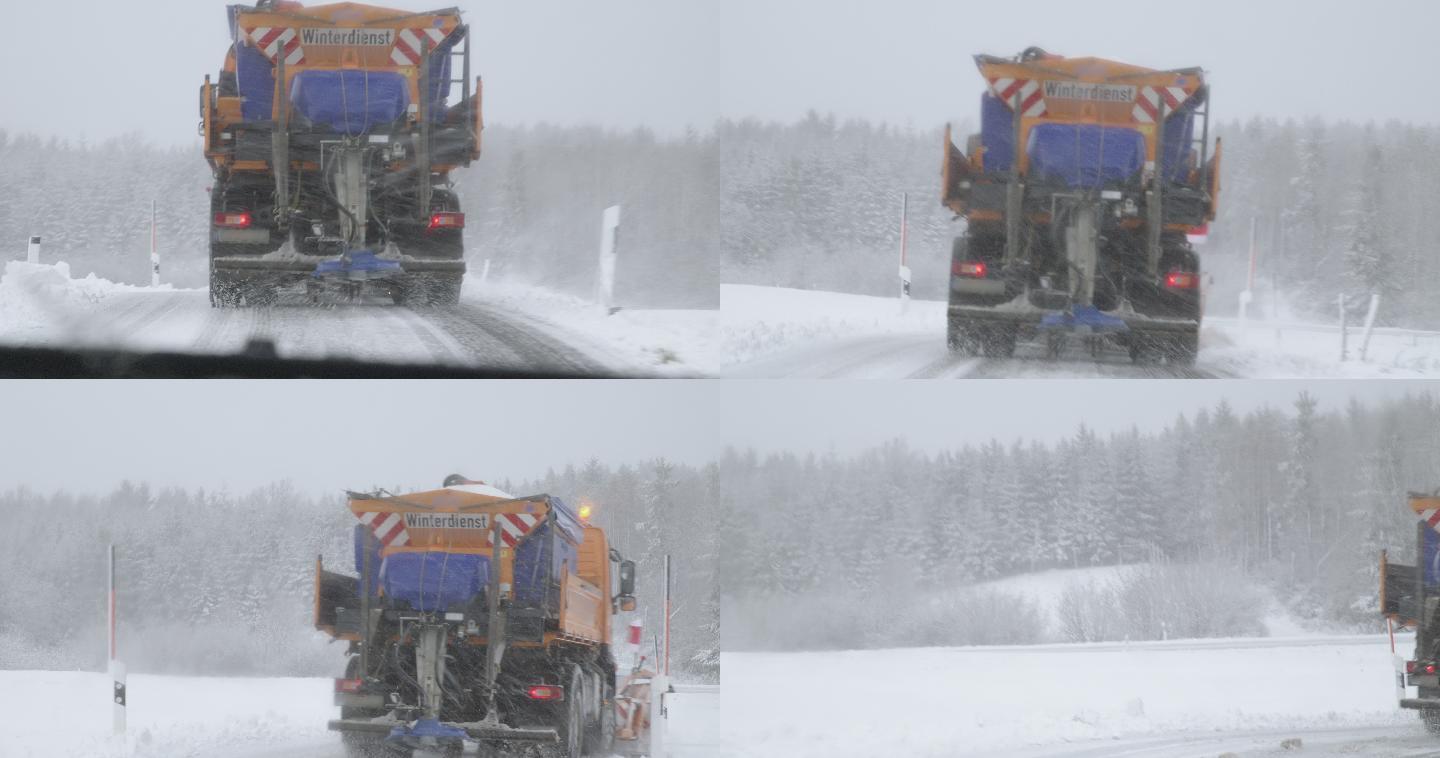 汽车跟随一辆铲雪车