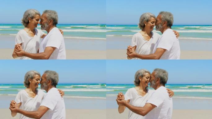老年夫妇在海滩上共舞