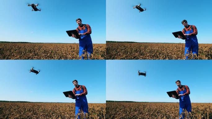 一名农业工人操作无人机