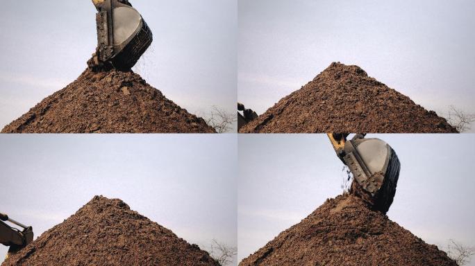 挖掘机卸砂和堆砂