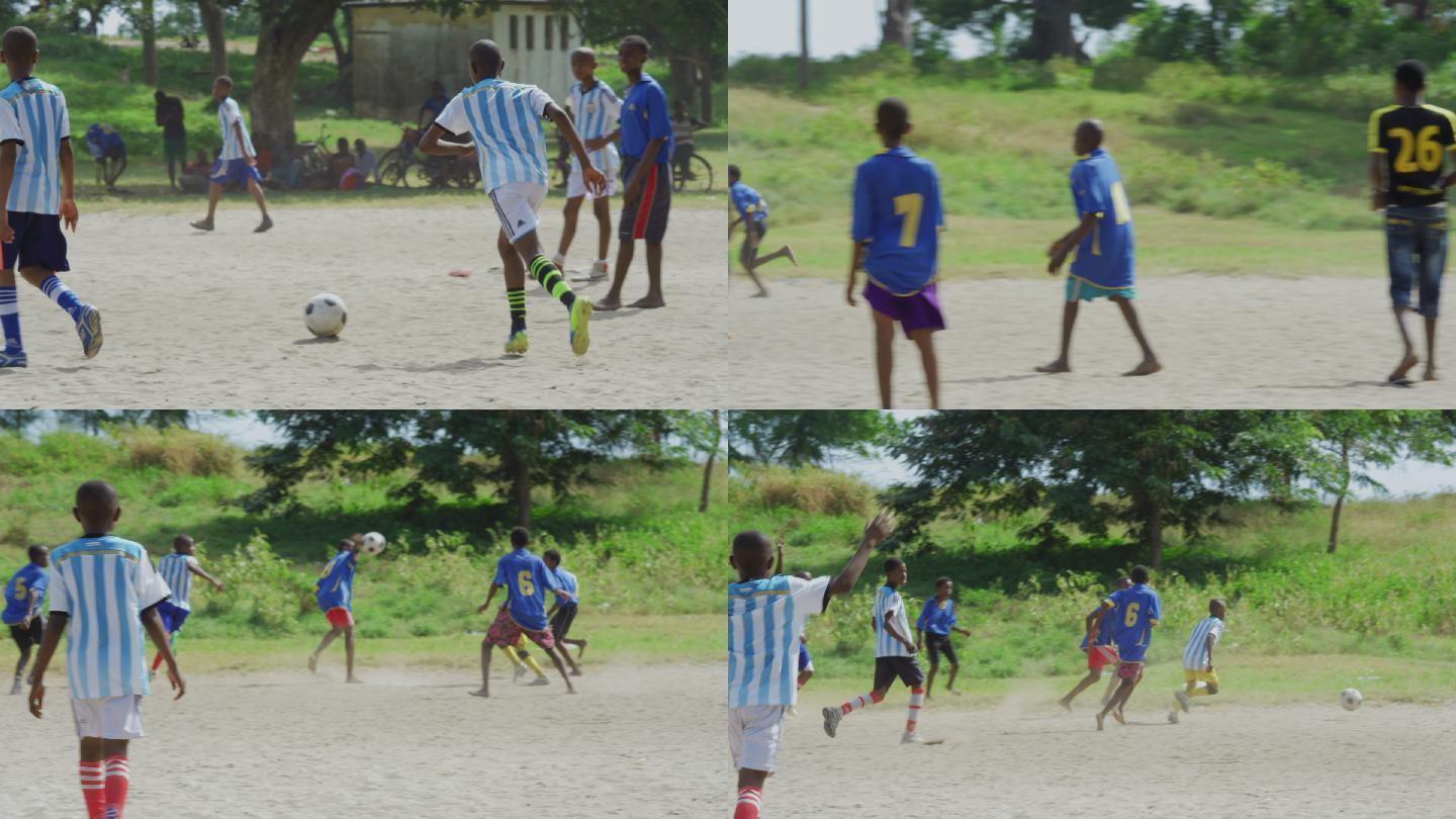 非洲男孩在沙地足球场踢足球