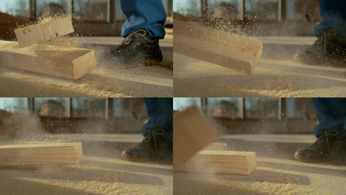 木板差点掉在工人的脚上