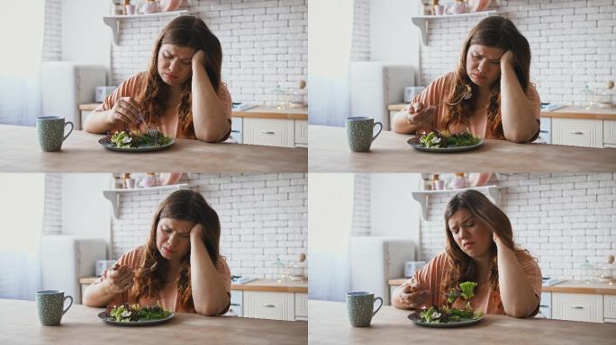 女人对吃沙拉的饮食感到不满