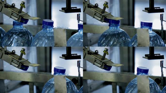 工厂为瓶装水封口的过程
