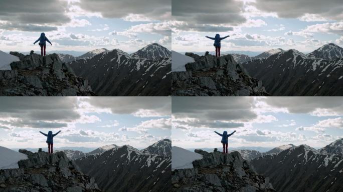 站在山顶上的人登山攀登励志攀岩跨越征服