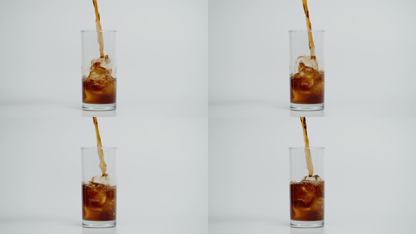 将可乐倒入加冰玻璃杯的超慢动作