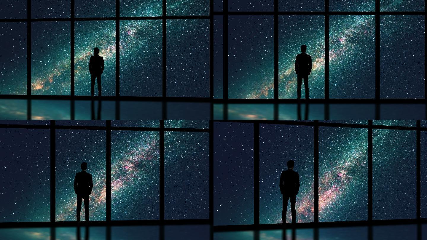 在星空背景下站在窗口的男性