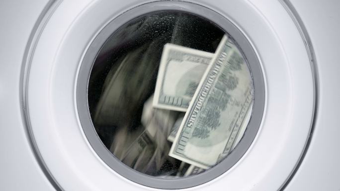 洗衣机里的金钱小海鲜权钱交易脏钱