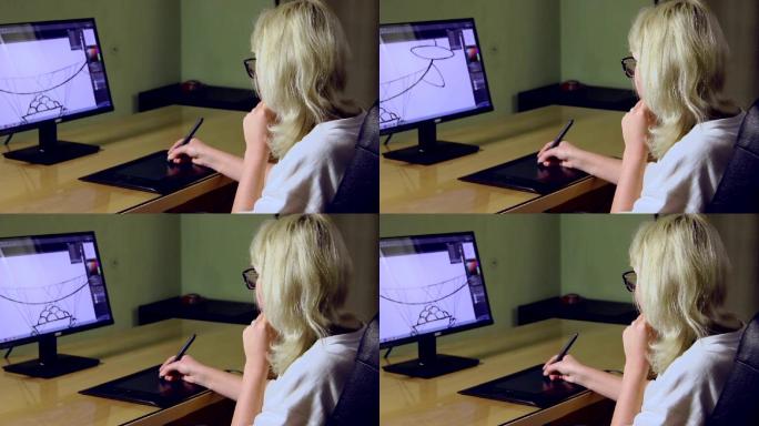 年轻设计师女孩使用图形平板电脑绘图