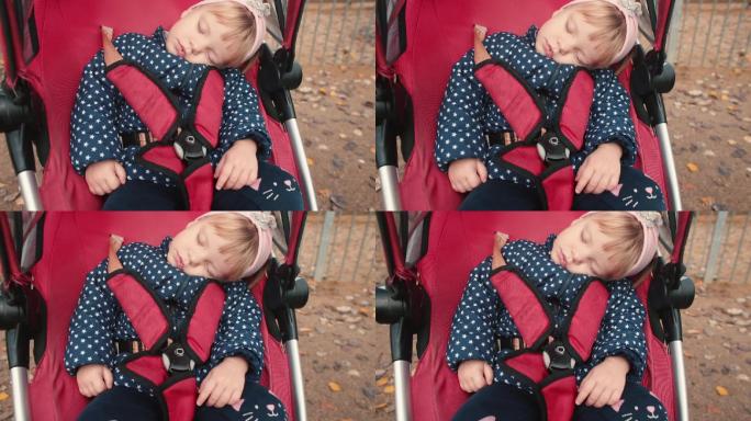 婴儿车里的两岁女孩在睡觉