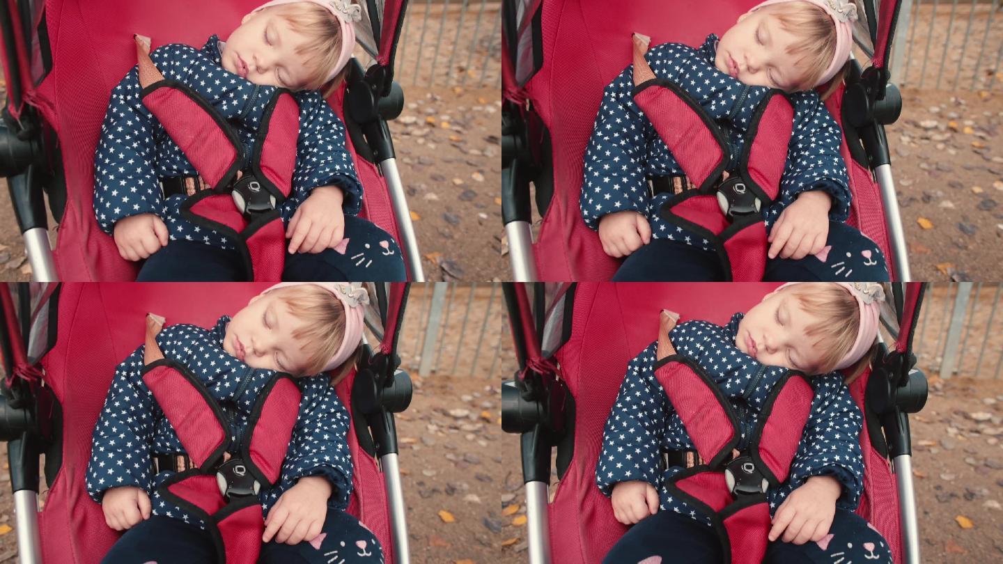 婴儿车里的两岁女孩在睡觉