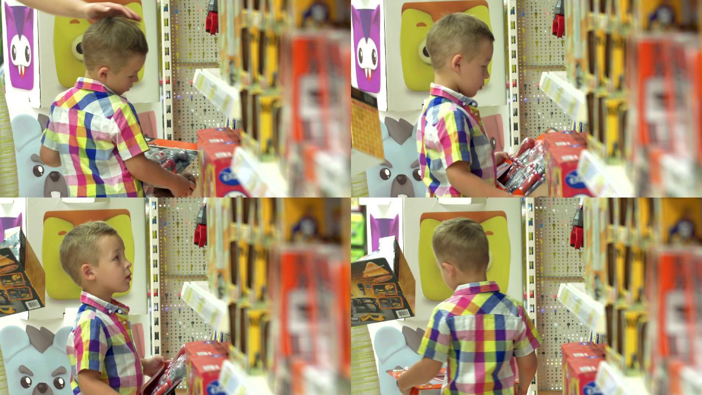 男孩在商店里挑选玩具