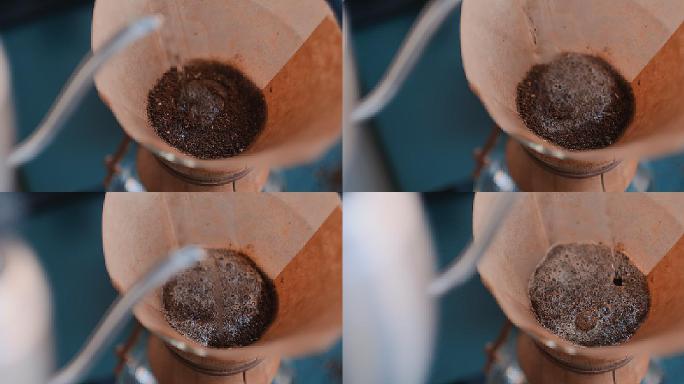 咖啡师用滤器将水倒在咖啡上