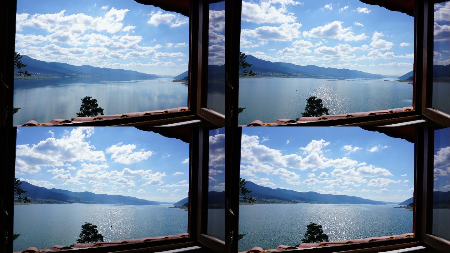 从度假别墅窗口看湖上的云层