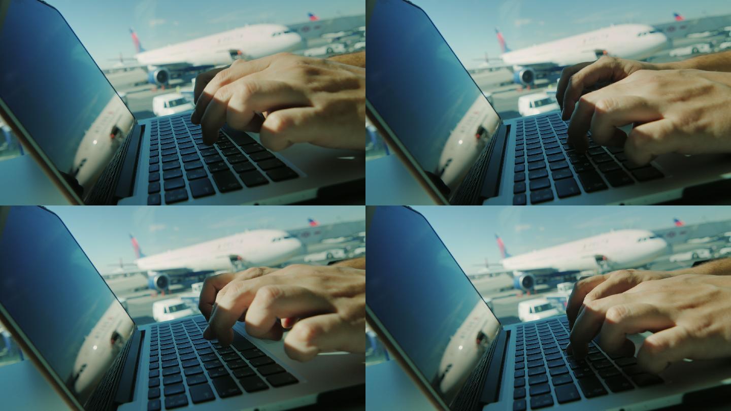 在机场使用笔记本电脑。