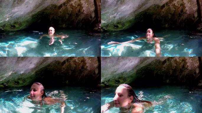 女子在洞穴内的淡水中游泳