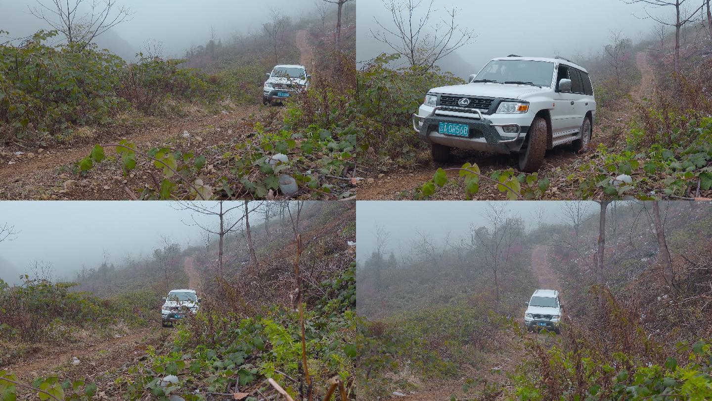 冬季山乡冰雪泥泞山路上艰难行驶的越野车