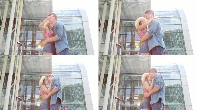 相爱的情侣在机场相遇，拥抱亲吻