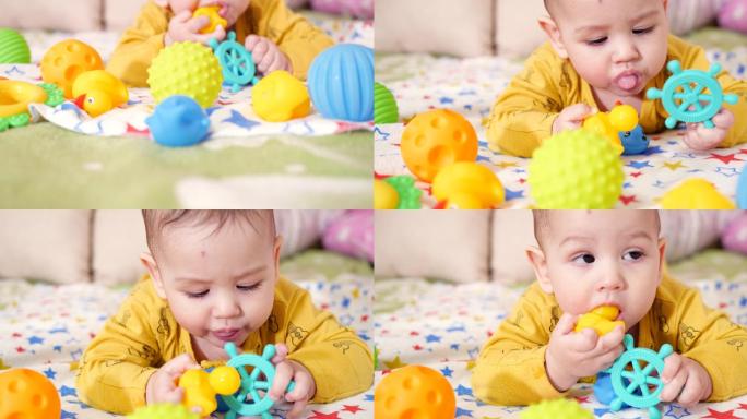 婴儿用牙齿咬玩具的特写镜头。