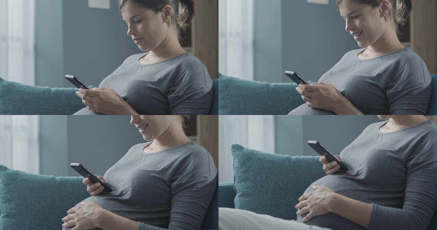 快乐的孕妇用智能手机聊天