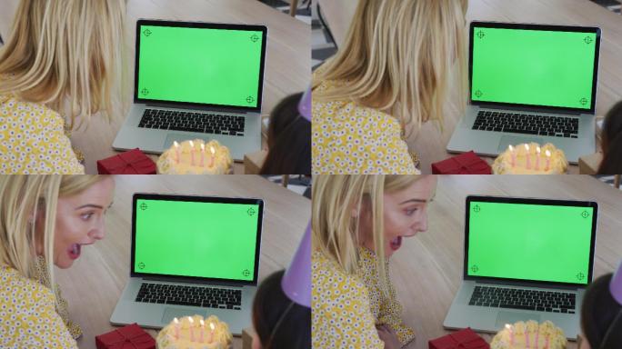 在家里用笔记本电脑视频聊天的女孩吹灭蜡烛