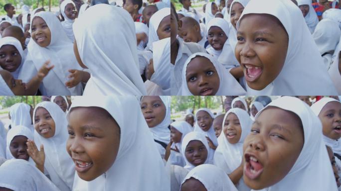 非洲小学生面对镜头拍手微笑