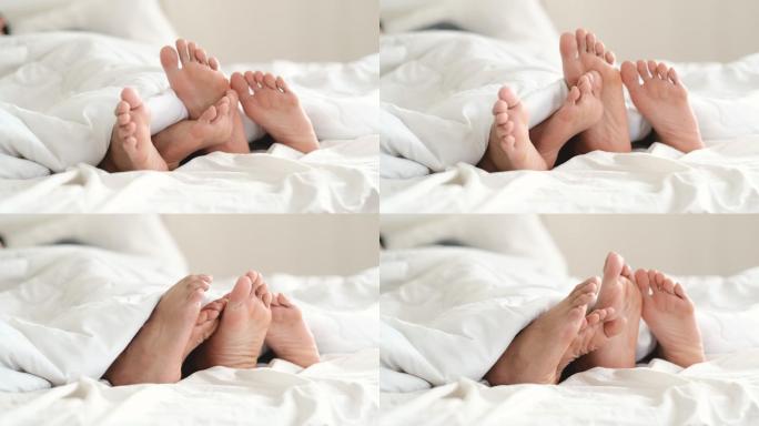 两只脚的情侣躺在床上