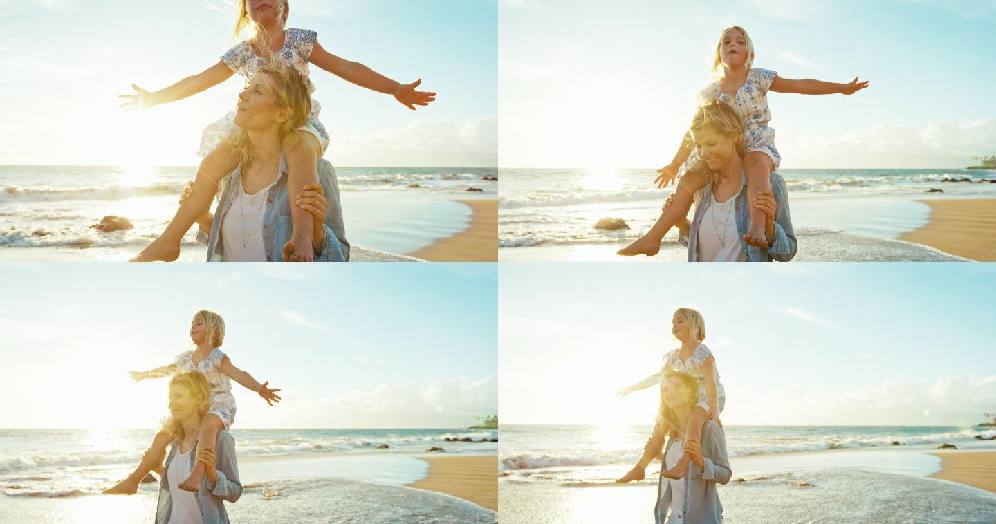 妈妈和女儿在海滩上玩耍