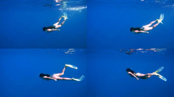 游泳的女人美女概念潜水艺术游泳池