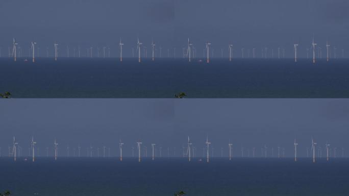 乡村的风力涡轮机风车大海海面清洁能源