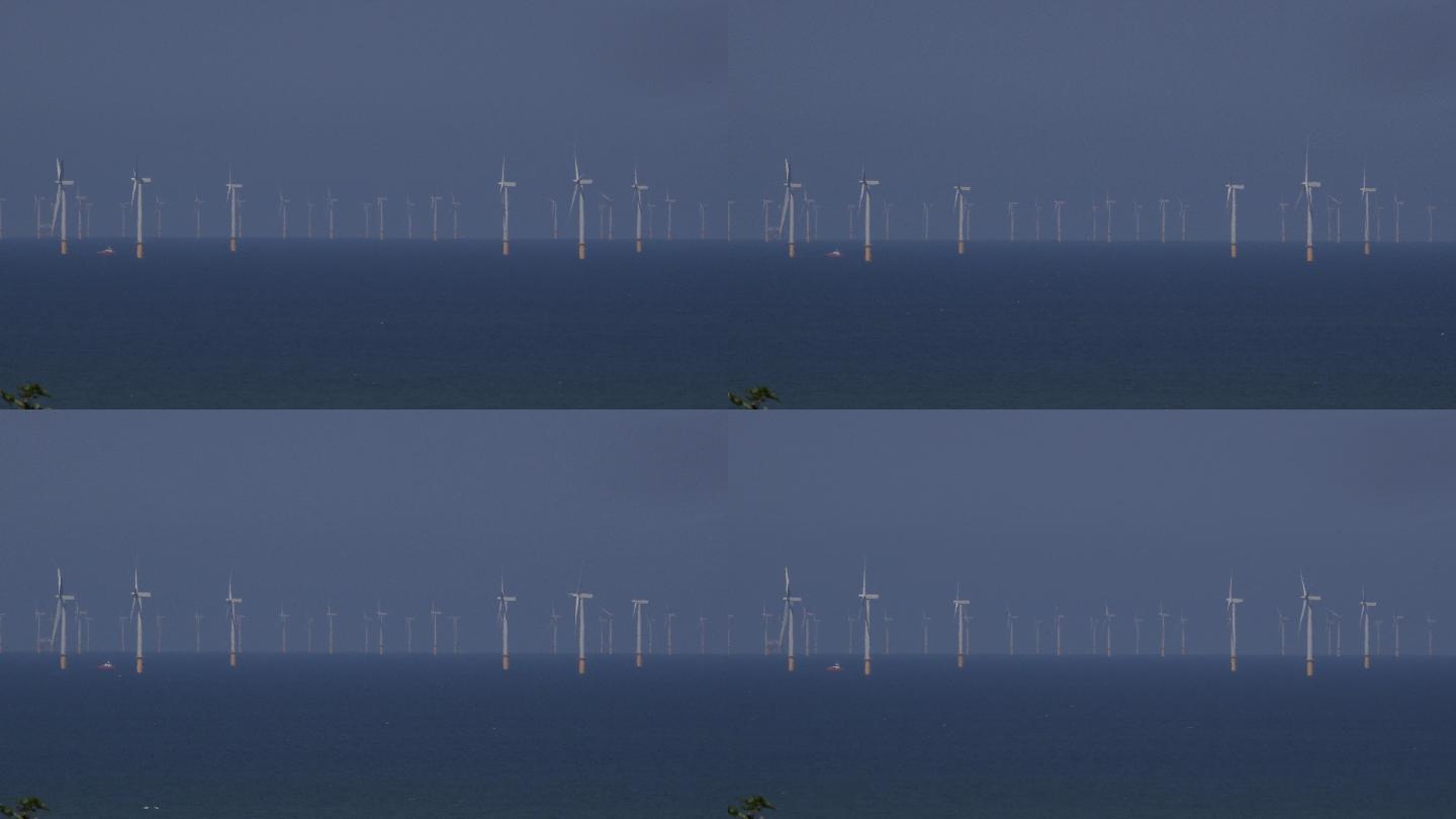 乡村的风力涡轮机风车大海海面清洁能源