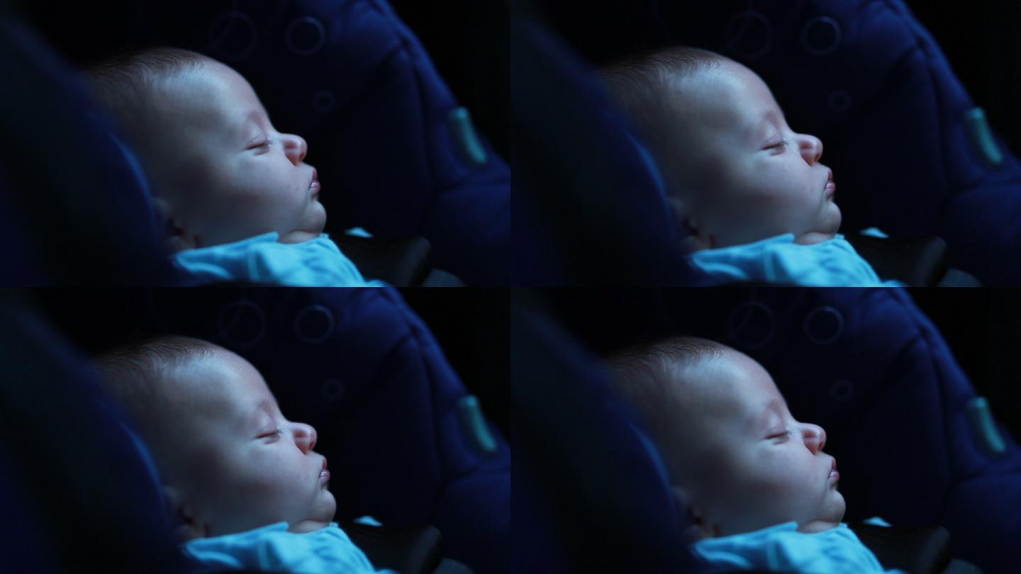 可爱的婴儿睡在汽车座椅上