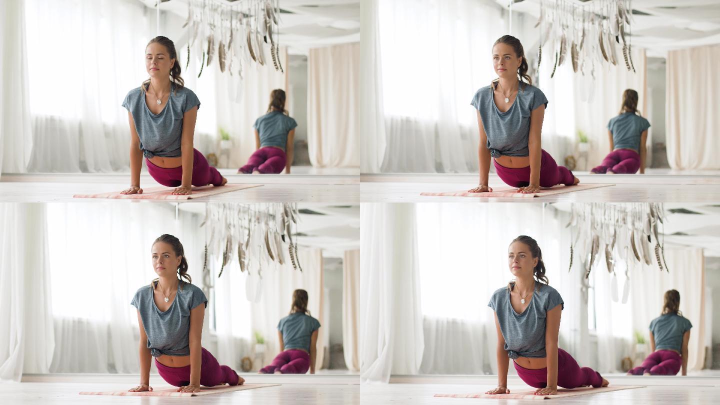 练习瑜伽的女性女性形体训练瘦身俯卧撑健康