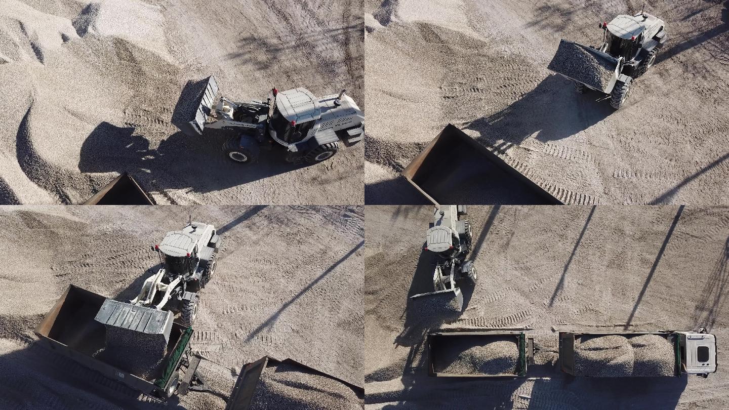 推土机在重型自卸卡车和拖车中装载碎石