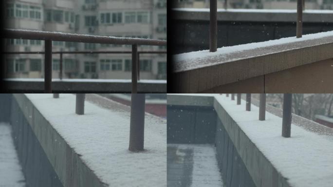 窗外寒冬写意雪景  铁栏杆下雪，屋檐积雪