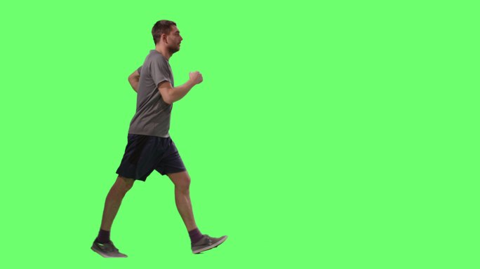 身穿T恤衫的男子在模拟绿色屏幕上运动行走。