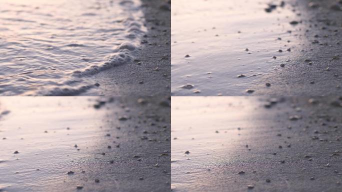 波浪拍打着沙滩上的石头