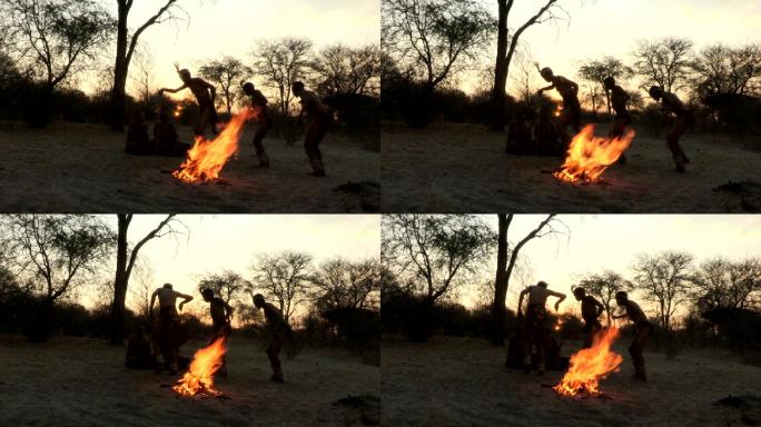 布须曼一家围着火跳传统舞蹈