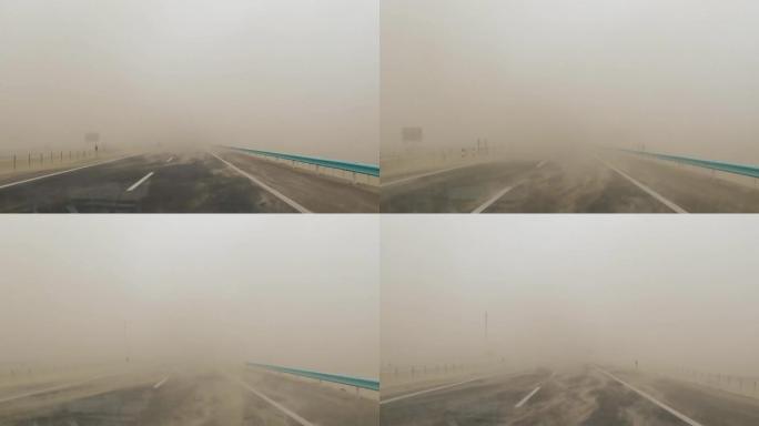 风沙 沙尘暴 汽车行驶在沙漠公路上