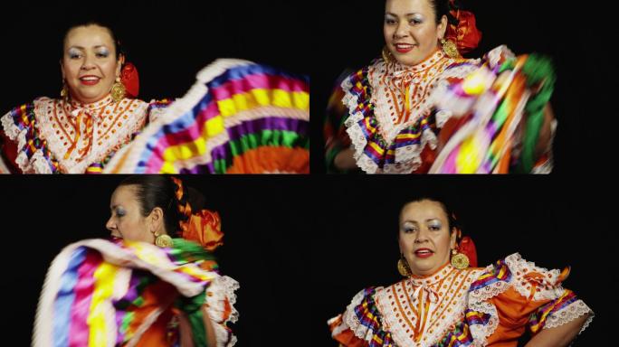 黑色背景下穿着墨西哥传统服装跳舞的女性
