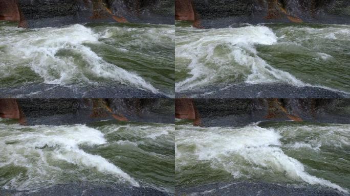 一条水流在巨大的岩石环境中缓慢流动