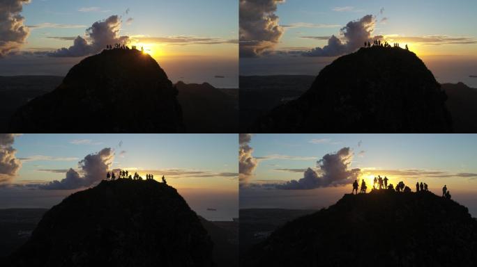 一群人站在山顶观夕阳的剪影素材