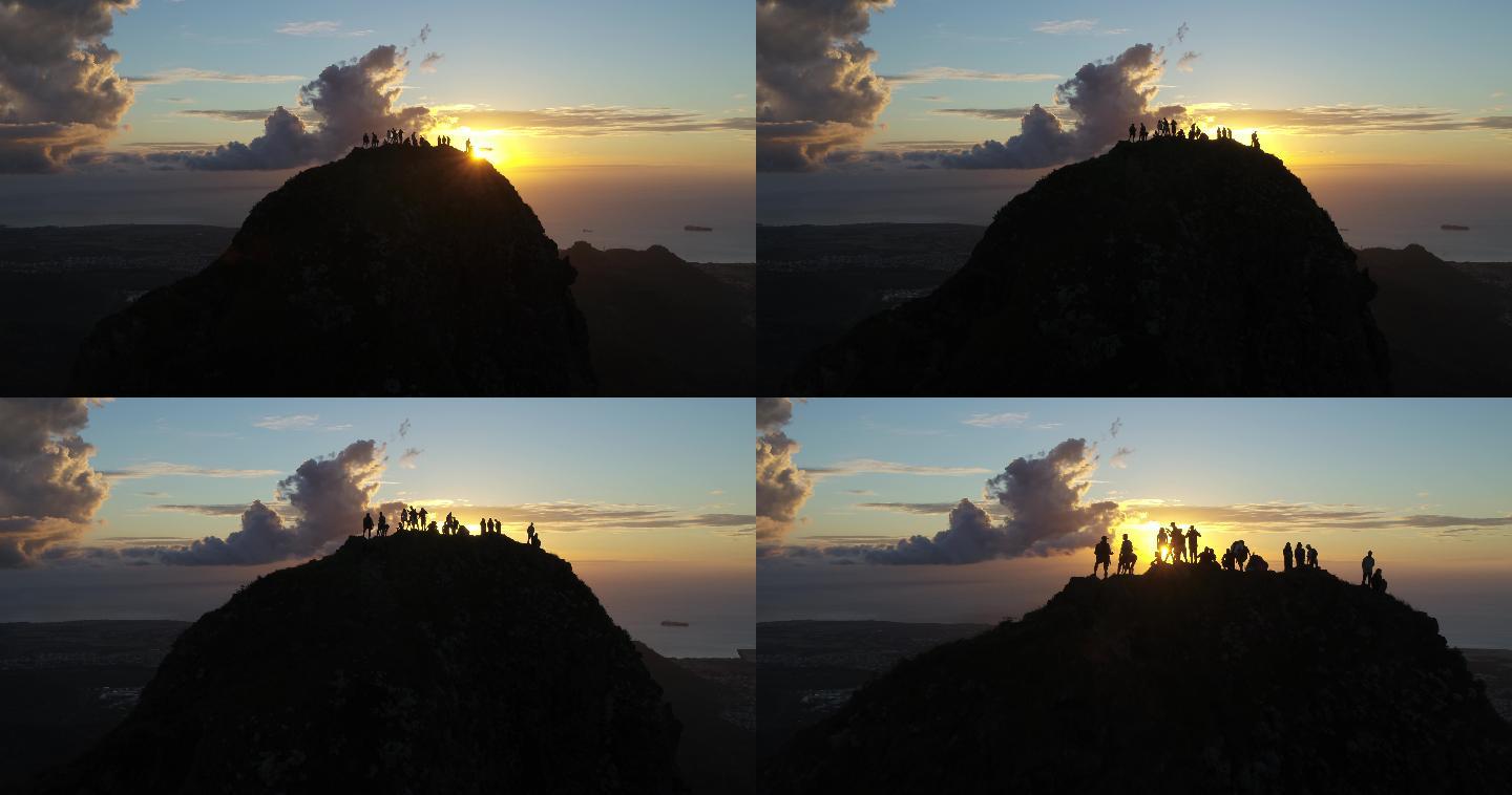 一群人站在山顶观夕阳的剪影素材