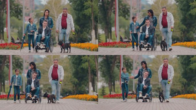 残疾人和家人在公园里散步