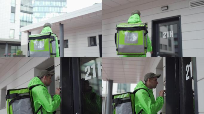 食品快递员带着热背包在街上运送食品的镜头